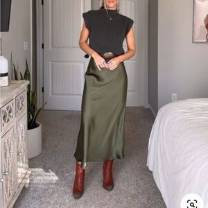 House of Harlow 1960 black size large silky midi skirt with side slit.